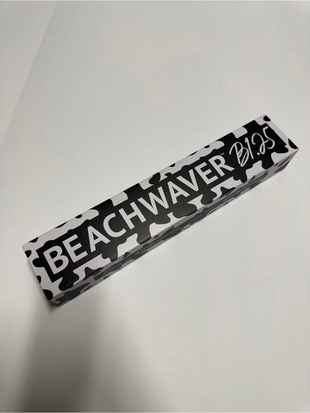 NEW. BeachWaver B1.25 Rotation Curling Iron Black & White Cow Print.